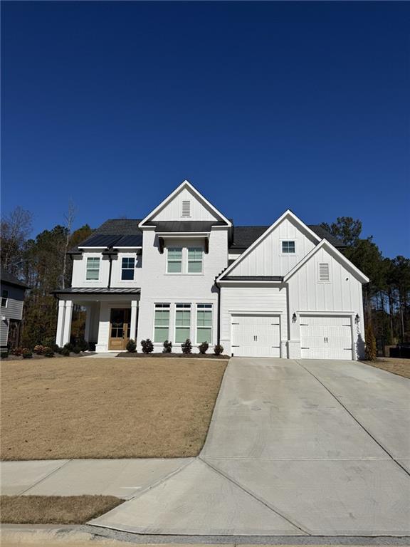 view of front of home with solar panels and a porch