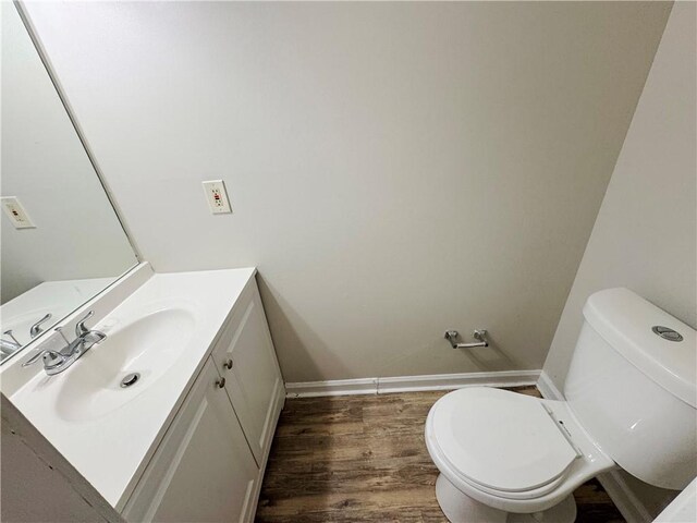 3589 Main Station Dr SW, Marietta, GA 30008 - bathroom featuring wood-type flooring, vanity, and toilet