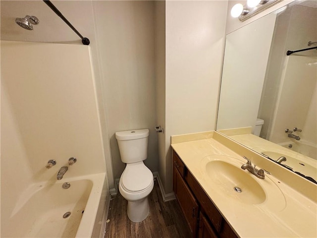 3589 Main Station Dr SW, Marietta, GA 30008 - full bathroom featuring bathing tub / shower combination, toilet, hardwood / wood-style flooring, and vanity