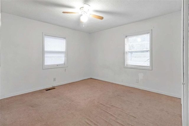 carpeted empty room with ceiling fan