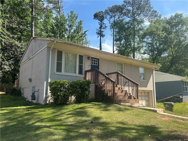 115 Delmoor Dr NW, Atlanta, GA 30311 - view of front of property with an attached garage, brick siding, and a front lawn