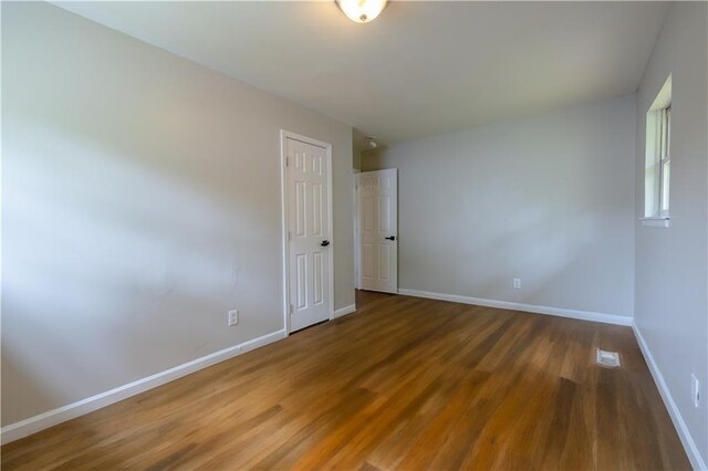 115 Delmoor Dr NW, Atlanta, GA 30311 - spare room with wood finished floors and baseboards