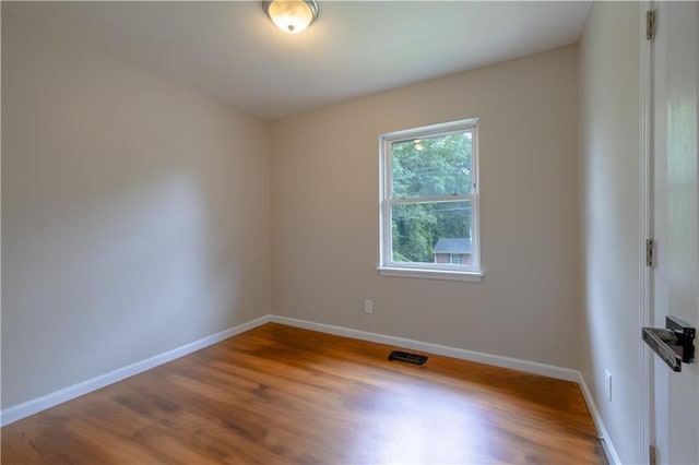 115 Delmoor Dr NW, Atlanta, GA 30311 - spare room featuring wood finished floors and baseboards