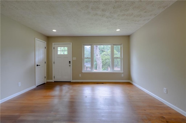 115 Delmoor Dr NW, Atlanta, GA 30311 - foyer entrance featuring healthy amount of natural light, a textured ceiling, wood finished floors, baseboards, and recessed lighting