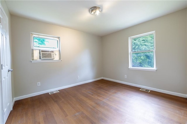 115 Delmoor Dr NW, Atlanta, GA 30311 - spare room with wood finished floors, baseboards, and cooling unit