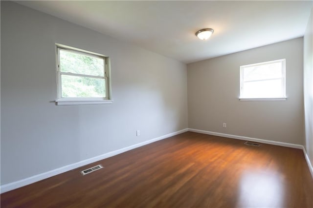 115 Delmoor Dr NW, Atlanta, GA 30311 - empty room featuring healthy amount of natural light, baseboards, and dark wood-style floors