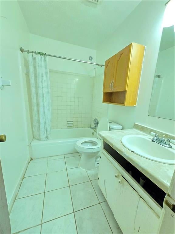 full bathroom with toilet, shower / tub combo with curtain, vanity, and tile patterned flooring