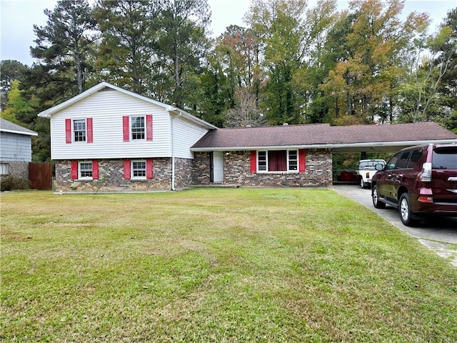 tri-level home with a front lawn and a carport