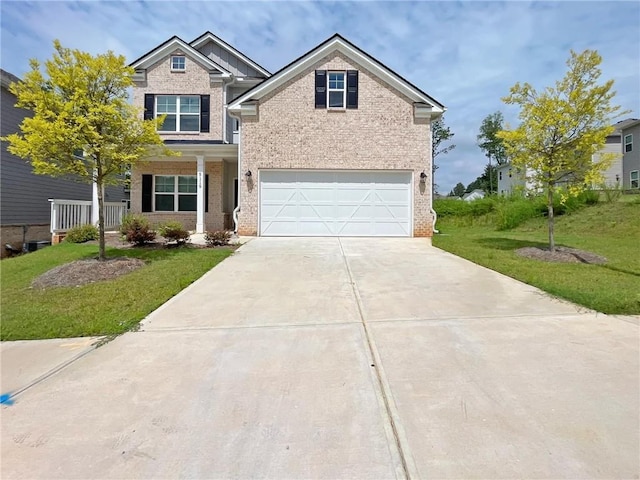 5119 Aylesbury Ct, Hoschton, GA 30548 - craftsman-style house with driveway, an attached garage, a front lawn, and brick siding