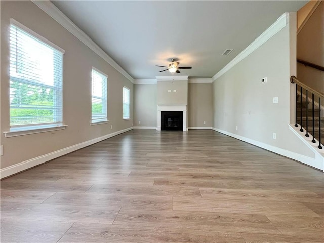 5119 Aylesbury Ct, Hoschton, GA 30548 - unfurnished living room featuring visible vents, crown molding, stairway, a ceiling fan, and light wood-style floors
