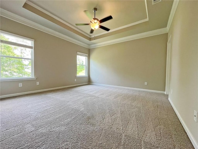 5119 Aylesbury Ct, Hoschton, GA 30548 - spare room with a tray ceiling, carpet, baseboards, ceiling fan, and ornamental molding
