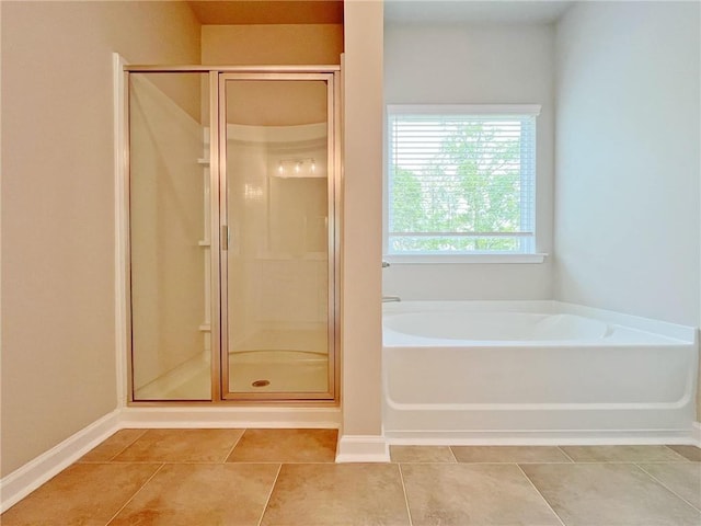 5119 Aylesbury Ct, Hoschton, GA 30548 - bathroom with tile patterned floors, a stall shower, and a garden tub