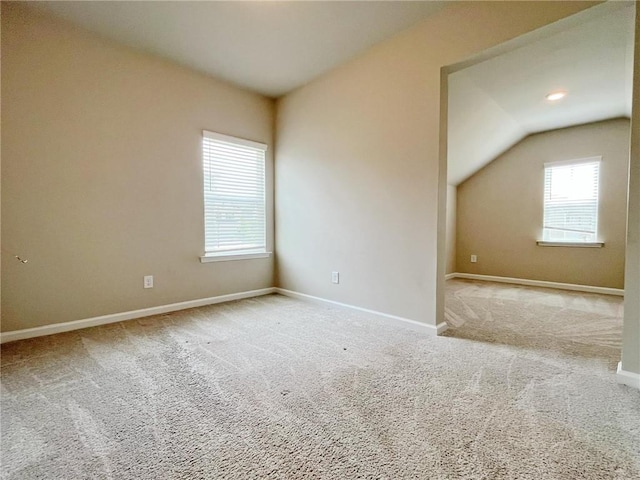 5119 Aylesbury Ct, Hoschton, GA 30548 - unfurnished room with baseboards, lofted ceiling, and carpet