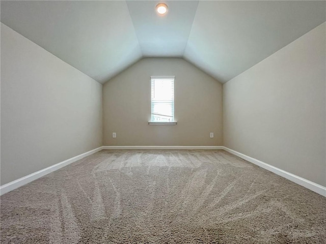 5119 Aylesbury Ct, Hoschton, GA 30548 - additional living space with baseboards, vaulted ceiling, and carpet floors