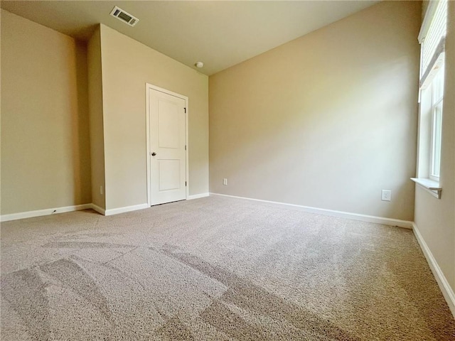 5119 Aylesbury Ct, Hoschton, GA 30548 - carpeted spare room with baseboards and visible vents