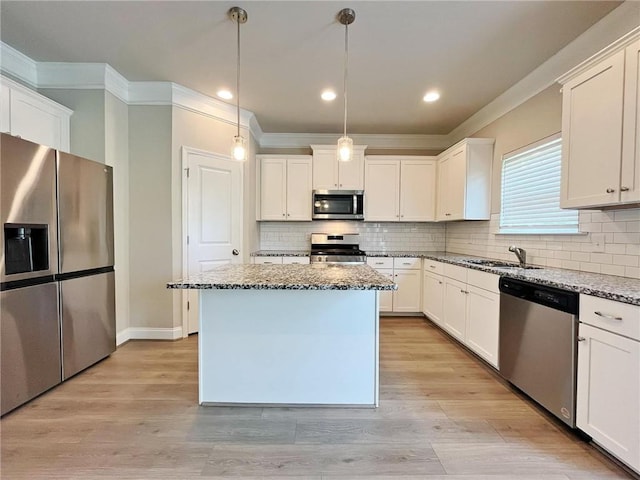5119 Aylesbury Ct, Hoschton, GA 30548 - kitchen featuring light wood finished floors, a sink, stone counters, and appliances with stainless steel finishes