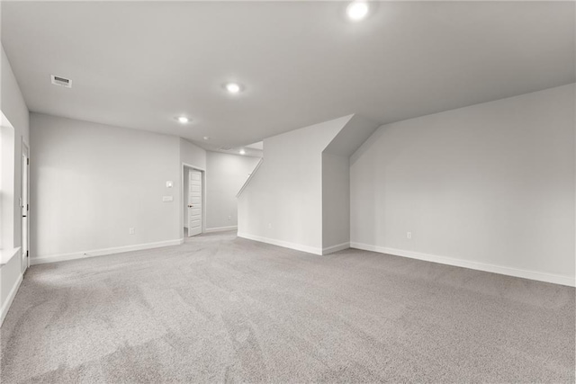 interior space featuring carpet flooring, baseboards, visible vents, and recessed lighting