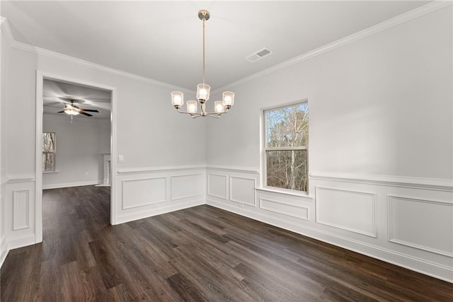 unfurnished dining area with a wainscoted wall, visible vents, a decorative wall, dark wood-style flooring, and ornamental molding