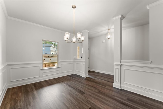 unfurnished dining area with a decorative wall, an inviting chandelier, a wainscoted wall, and dark wood-type flooring