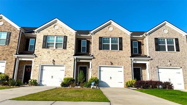 473 Broder Farms Dr, Stockbridge, GA 30281 - view of property with a garage, driveway, brick siding, and a front yard