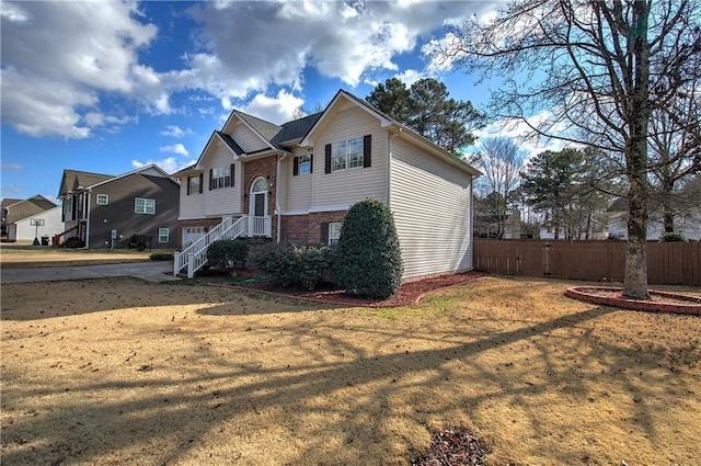 bi-level home with a front yard