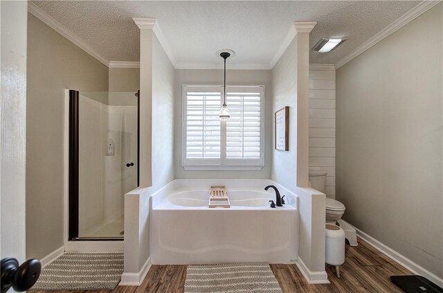 bathroom featuring crown molding, a textured ceiling, toilet, shower with separate bathtub, and hardwood / wood-style flooring