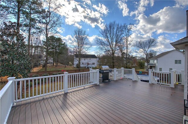 deck featuring a grill