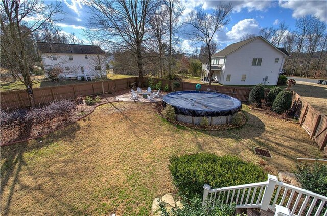 view of yard featuring a covered pool