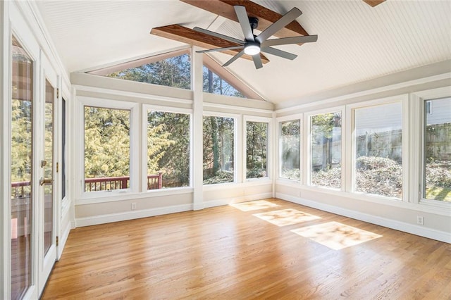 unfurnished sunroom with lofted ceiling and ceiling fan