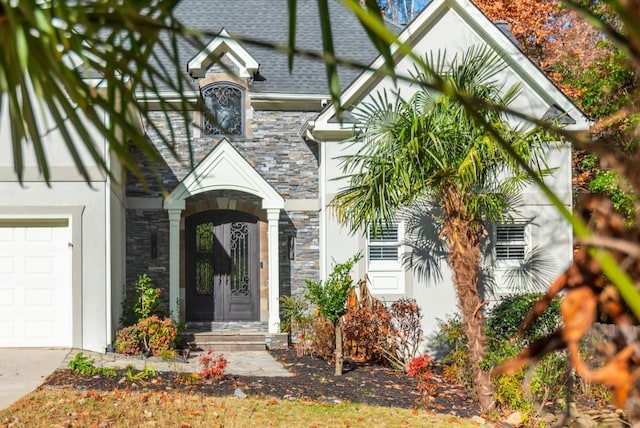 view of exterior entry with a garage