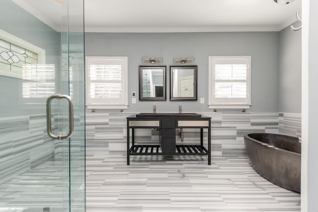 bathroom with vanity, separate shower and tub, crown molding, and tile walls