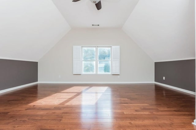 additional living space featuring ceiling fan, dark hardwood / wood-style flooring, and vaulted ceiling