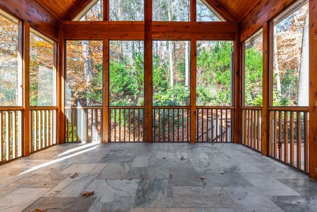 unfurnished sunroom with vaulted ceiling