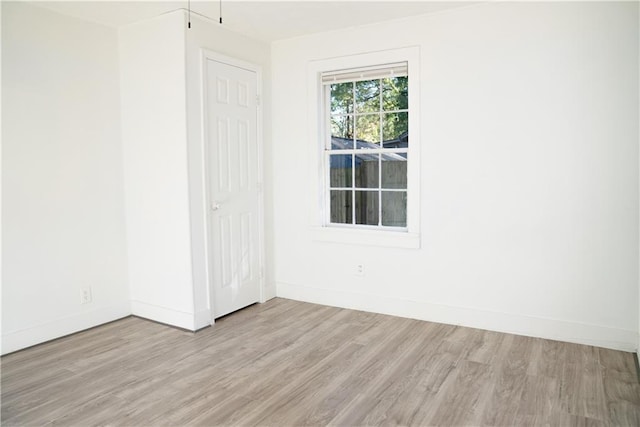 spare room featuring light hardwood / wood-style floors