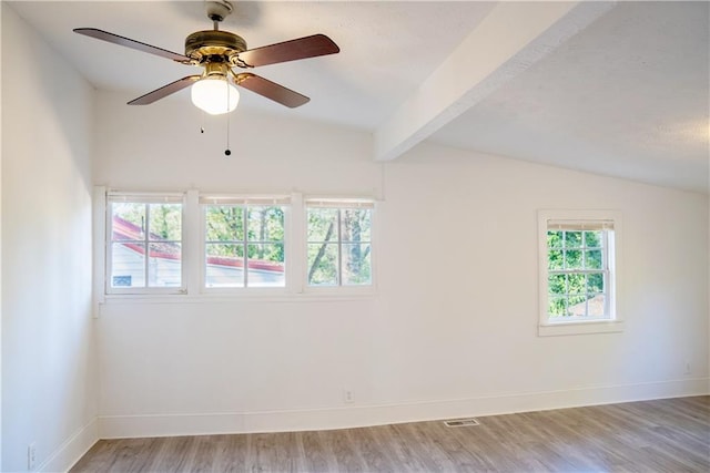 unfurnished room with vaulted ceiling with beams, light hardwood / wood-style floors, and ceiling fan