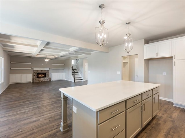 632 Eagles Nest Cir, Auburn, GA 30011 - kitchen featuring pendant lighting, beamed ceiling, light countertops, a kitchen island, and gray cabinets