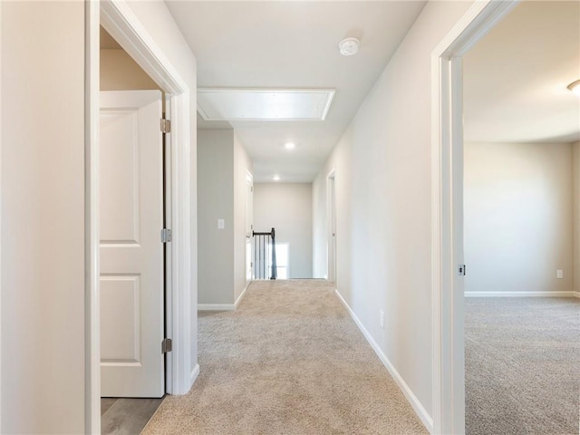 632 Eagles Nest Cir, Auburn, GA 30011 - hallway with attic access, carpet, and baseboards