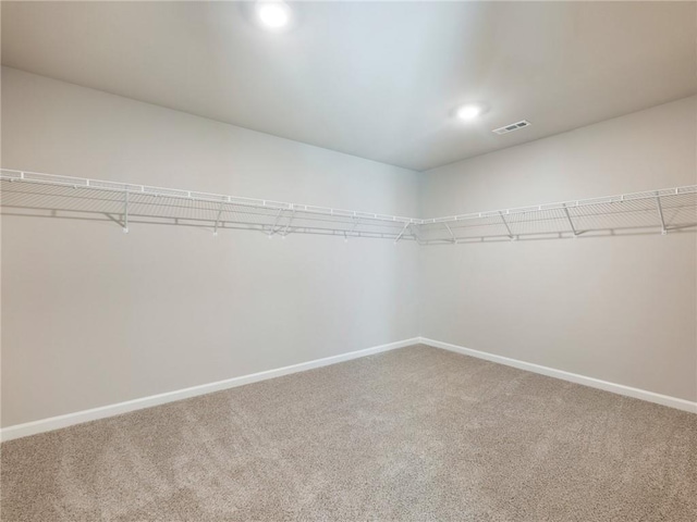 632 Eagles Nest Cir, Auburn, GA 30011 - walk in closet featuring carpet flooring and visible vents