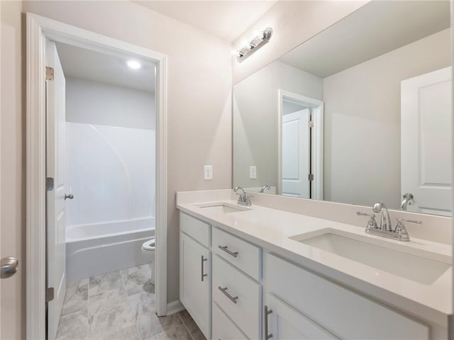 632 Eagles Nest Cir, Auburn, GA 30011 - full bathroom with marble finish floor, a sink, double vanity, and toilet