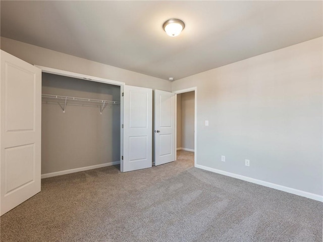 632 Eagles Nest Cir, Auburn, GA 30011 - unfurnished bedroom featuring baseboards, carpet flooring, and a closet