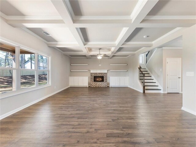 632 Eagles Nest Cir, Auburn, GA 30011 - unfurnished living room with stairway, beam ceiling, dark wood-type flooring, a ceiling fan, and baseboards