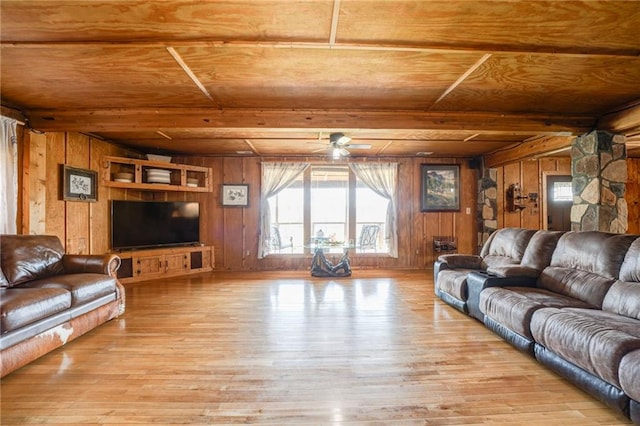 living room with wooden walls, light hardwood / wood-style floors, and wood ceiling