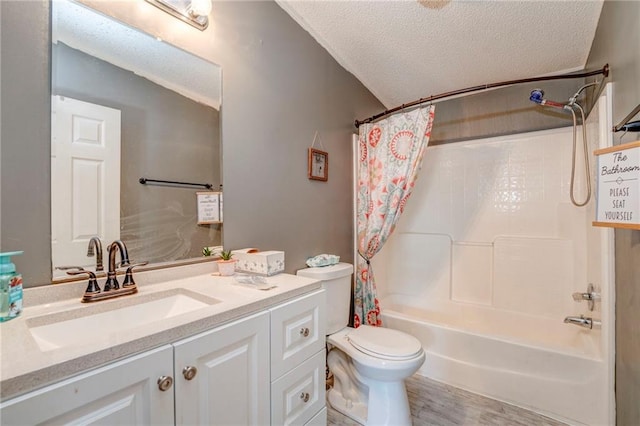 full bathroom featuring a textured ceiling, shower / tub combo with curtain, wood-type flooring, vanity, and toilet