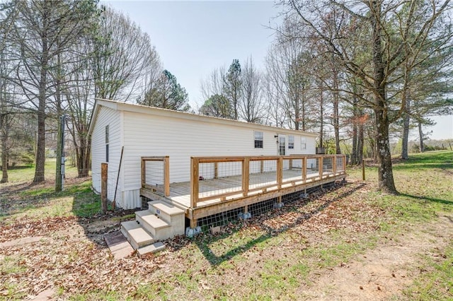 back of property with a wooden deck