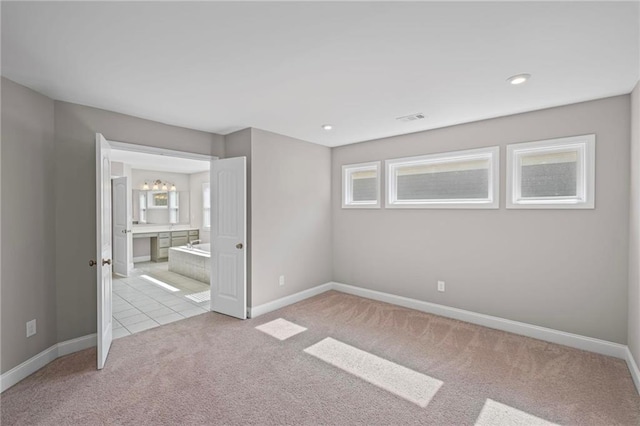 5153 Elkins Ln, Acworth, GA 30101 - unfurnished bedroom with carpet floors, ensuite bath, recessed lighting, and a chandelier