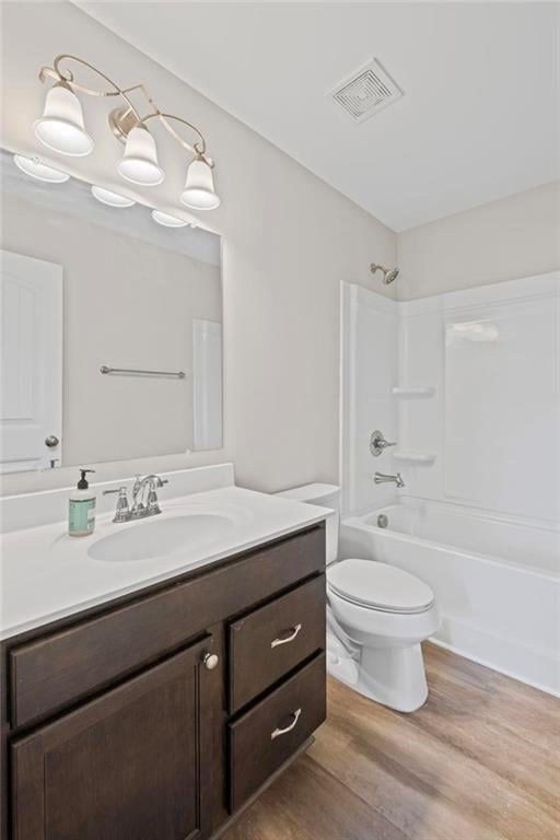 5153 Elkins Ln, Acworth, GA 30101 - bathroom with vanity, wood finished floors, and shower / bath combination