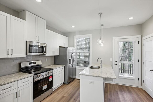 1095 Tucker Ave Unit 401, Atlanta, GA 30310 - kitchen featuring stainless steel appliances, a sink, light wood-style flooring, white cabinetry, and recessed lighting
