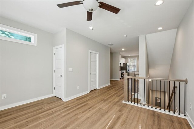 1095 Tucker Ave Unit 401, Atlanta, GA 30310 - spare room featuring a ceiling fan, light wood-type flooring, baseboards, and recessed lighting
