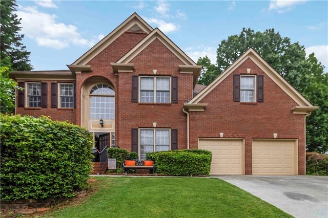 3780 Summit Gate Dr, Suwanee, GA 30024 - view of front of house featuring driveway, an attached garage, a front lawn, and brick siding