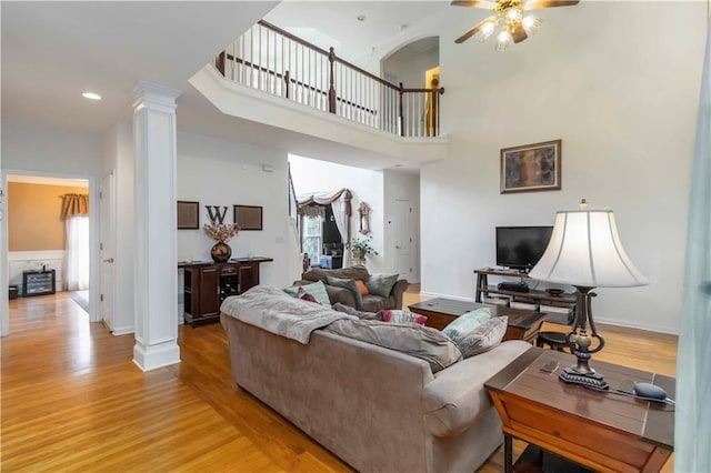 3780 Summit Gate Dr, Suwanee, GA 30024 - living area with ornate columns, a ceiling fan, light wood finished floors, recessed lighting, and baseboards